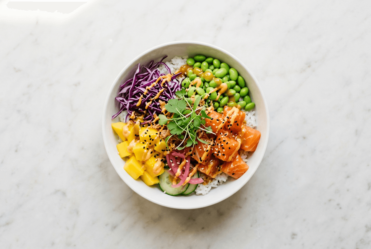 Overhead poke bowl photo on clean marble surface showing ideal delivery app food photography composition