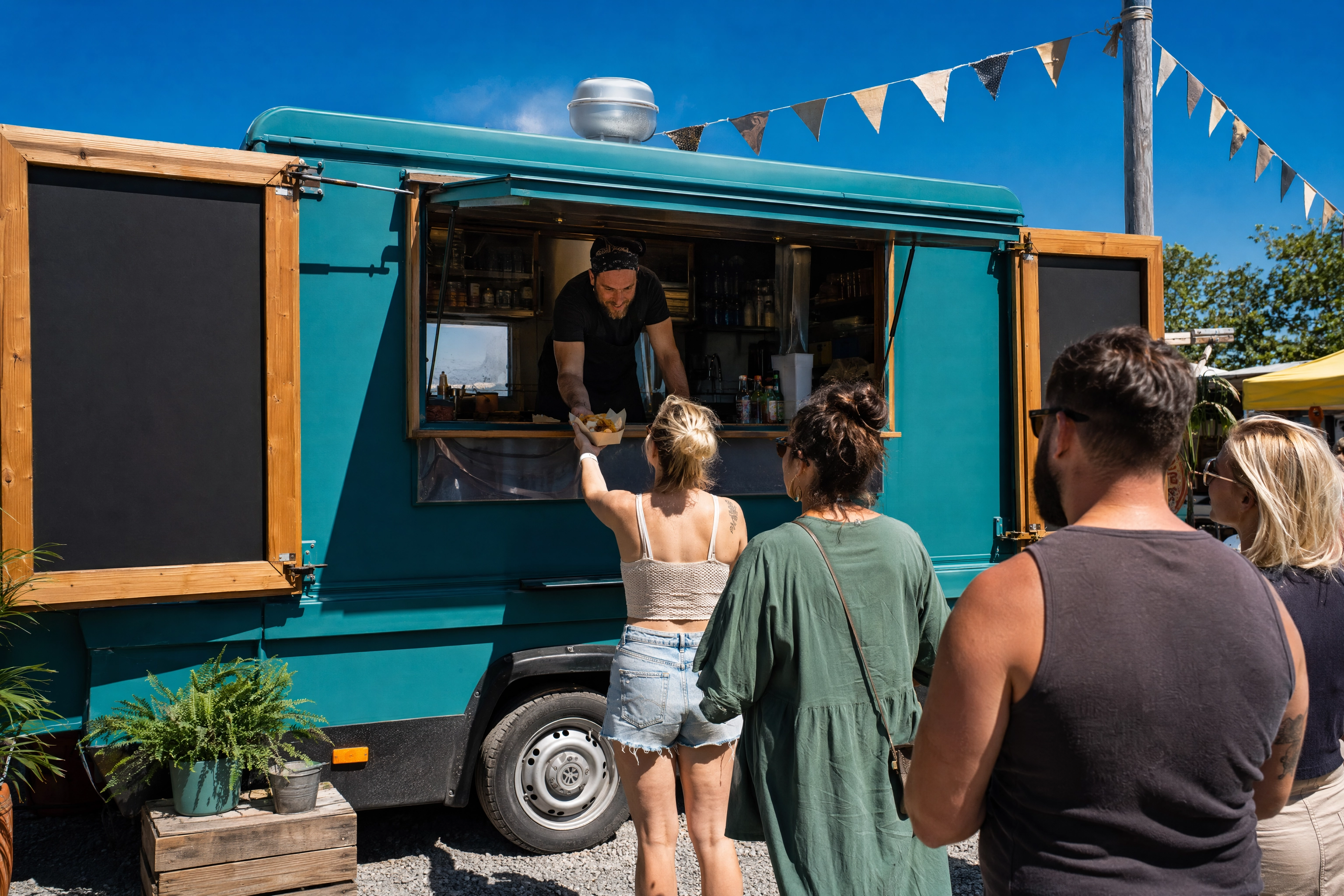 Food truck menu board idea: hinged wing panels swung open beside the service hatch to double the width