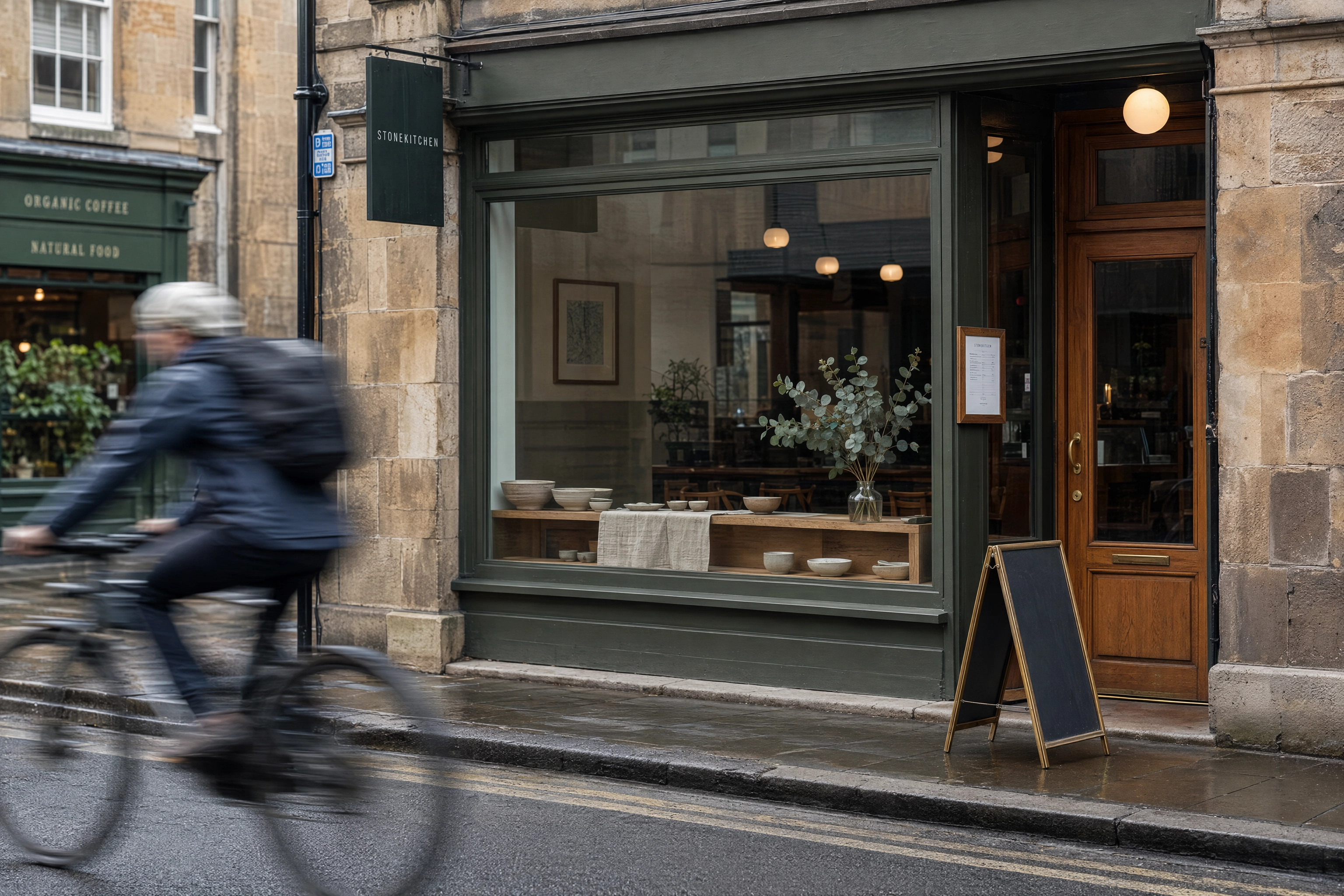 Independent restaurant shopfront window in morning light, the physical equivalent of an Instagram profile