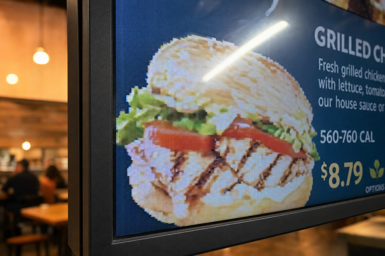 Close-up of a pixelated low-quality food photo on a digital menu board screen showing how poor resolution looks unprofessional