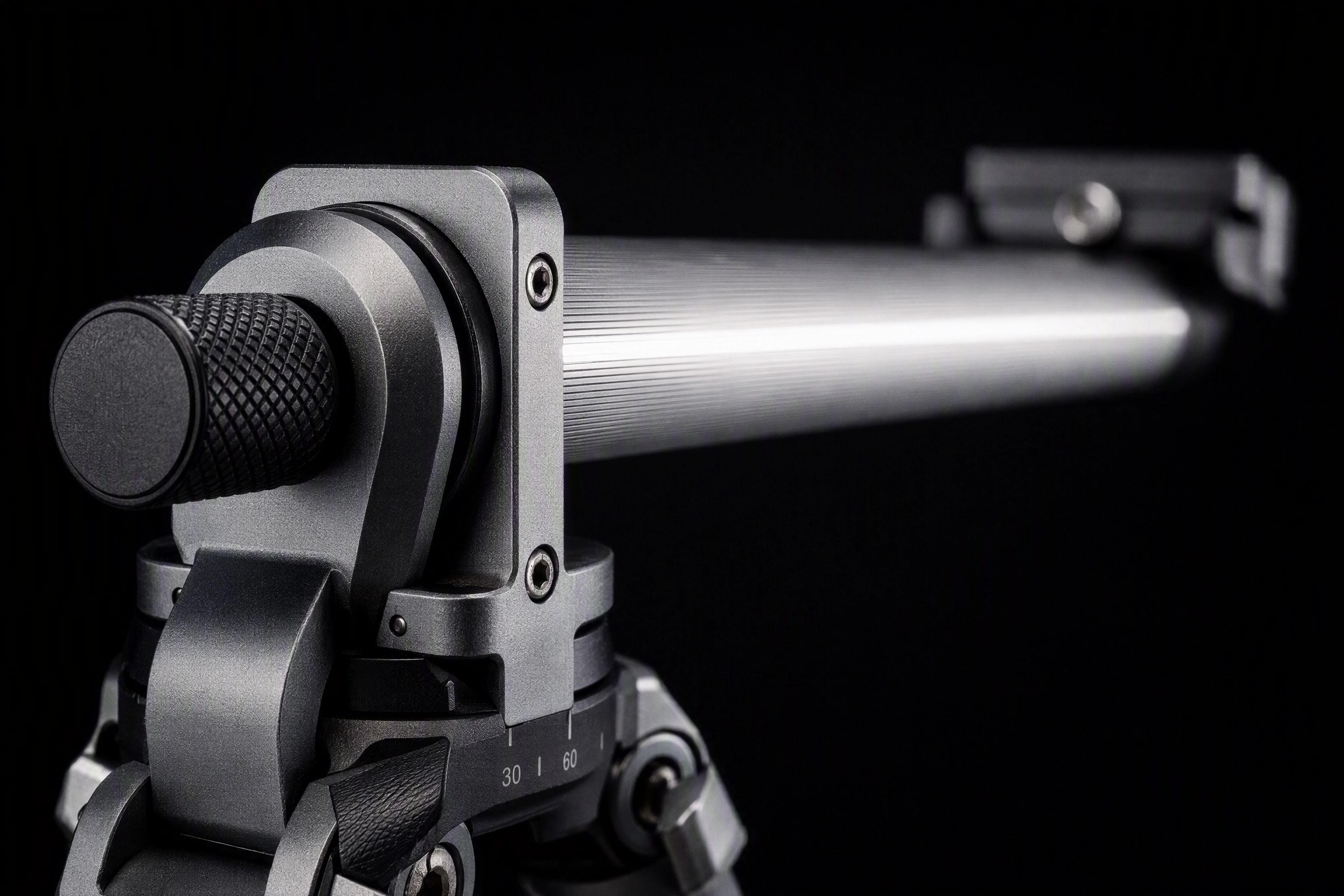 Macro detail of a tripod centre column locked horizontal at the collar hinge for overhead food shots
