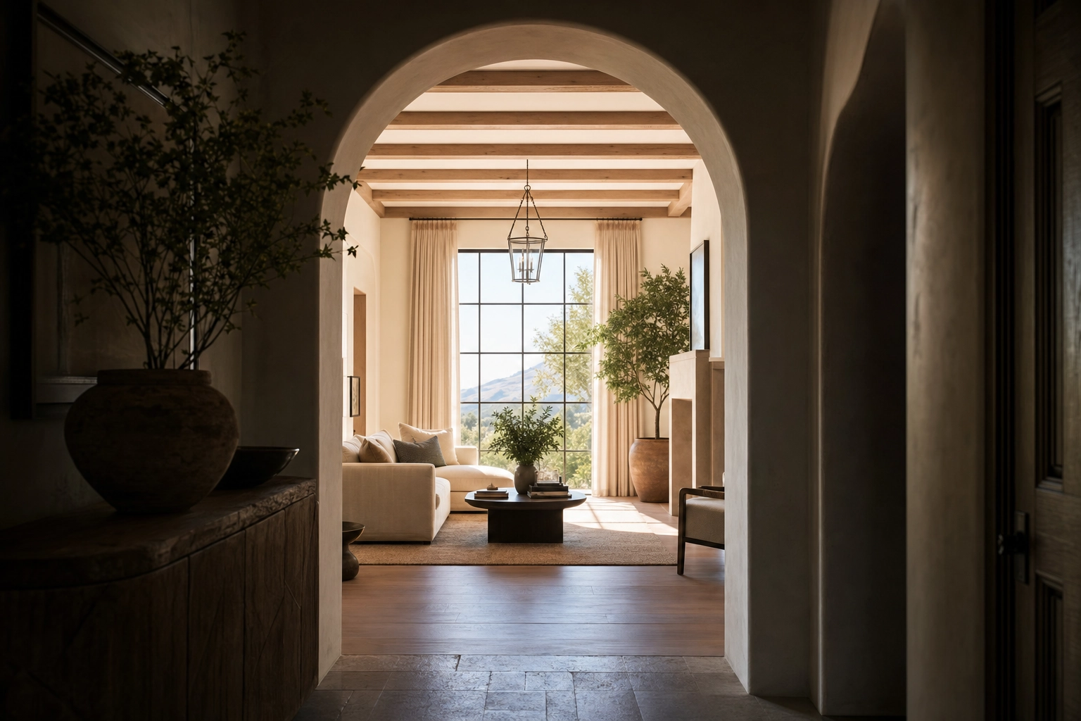 View composed through an archway into a bright room to create depth in listing photos
