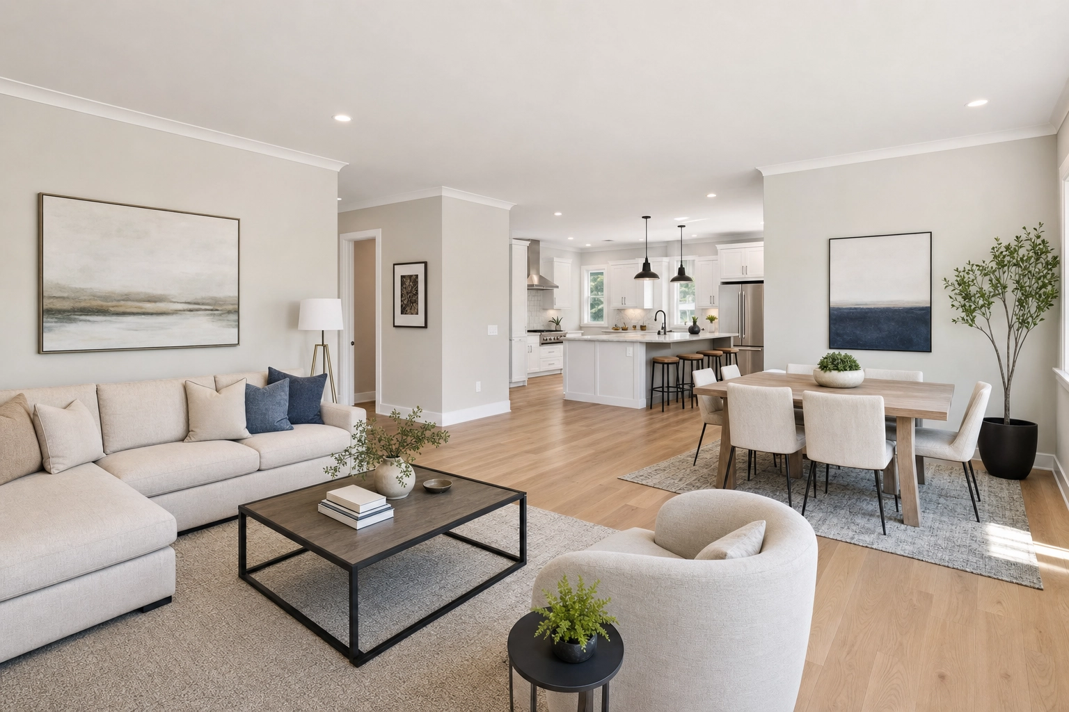 Open-plan living and dining room shot from a corner showing the 3-wall composition rule
