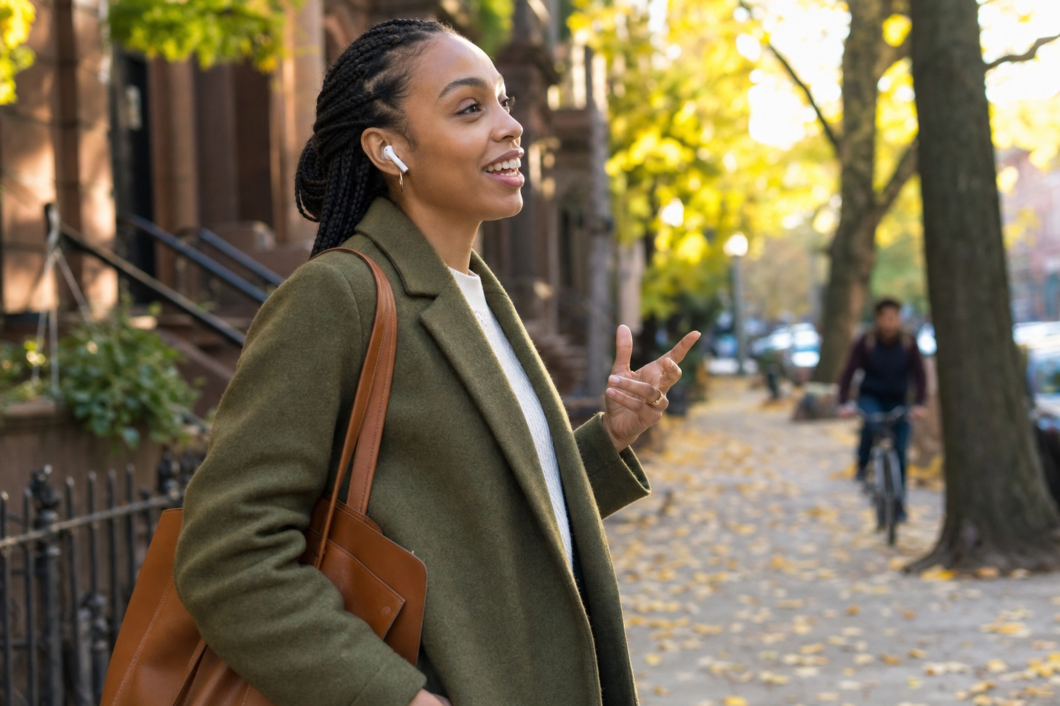 Young woman walking confidently outdoors while having a real-time English voice conversation through earbuds without judgment or fear